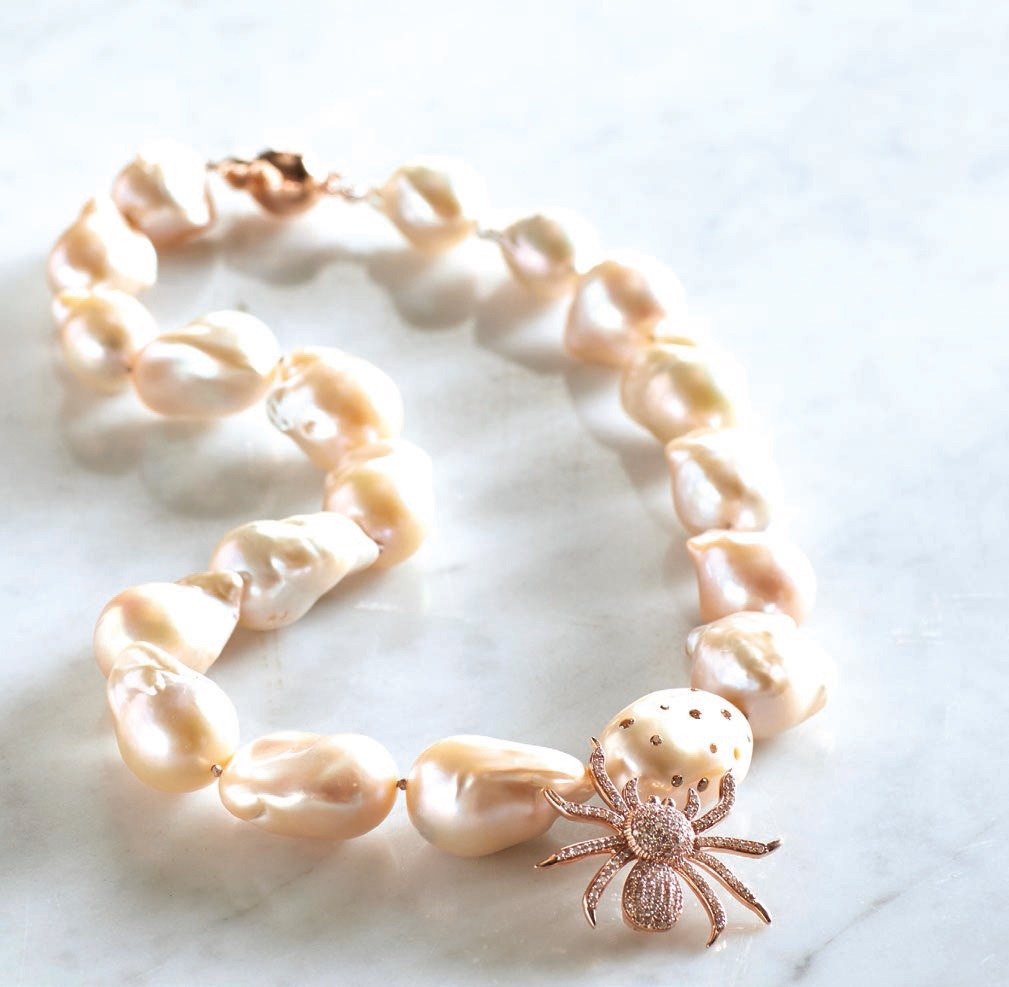 XL baroque apricot pearls are accented with a rose gold diamond pavé spider, clasp and scattered diamondset pearl. PHOTO COURTESY OF BRAND